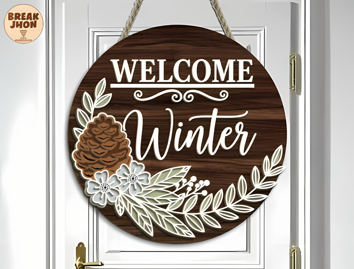 Rustic circle with pine boughs and a welcome message as a winter sign laser cut for an entryway